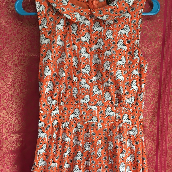 Yumi Dresses & Skirts - Super sweet women’s dress by Yumi. US size 0/2. Cute lion and flower print.
